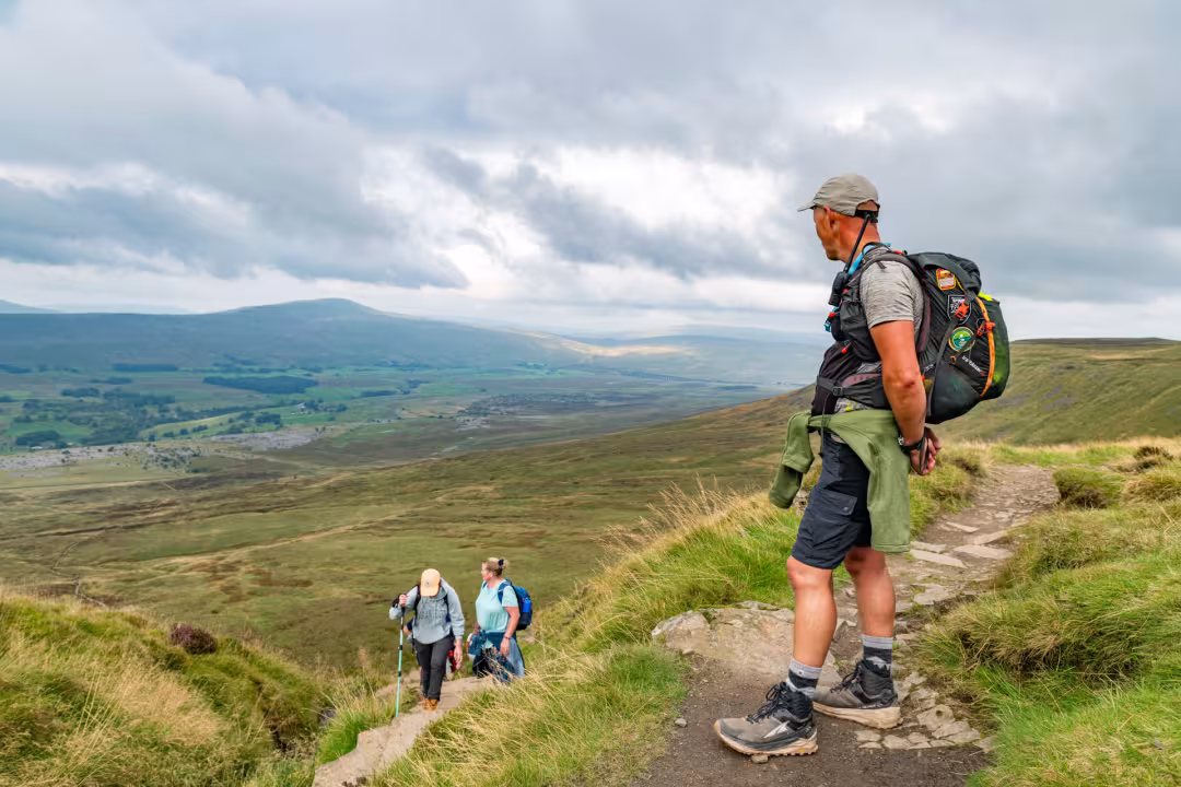 Man standing at the top of Ingleborough