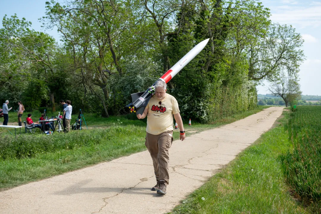 Ben Jarvis carrying a rocket