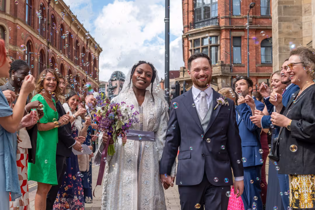 Couple walking through confetti