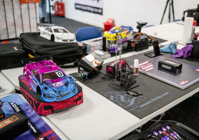 Purple and blue RC car on table 