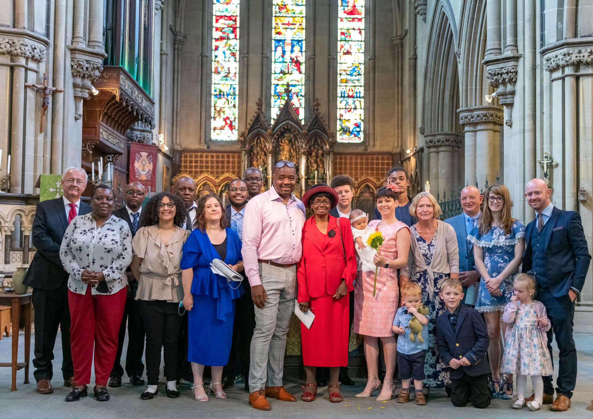 Family image after a baptism in a church