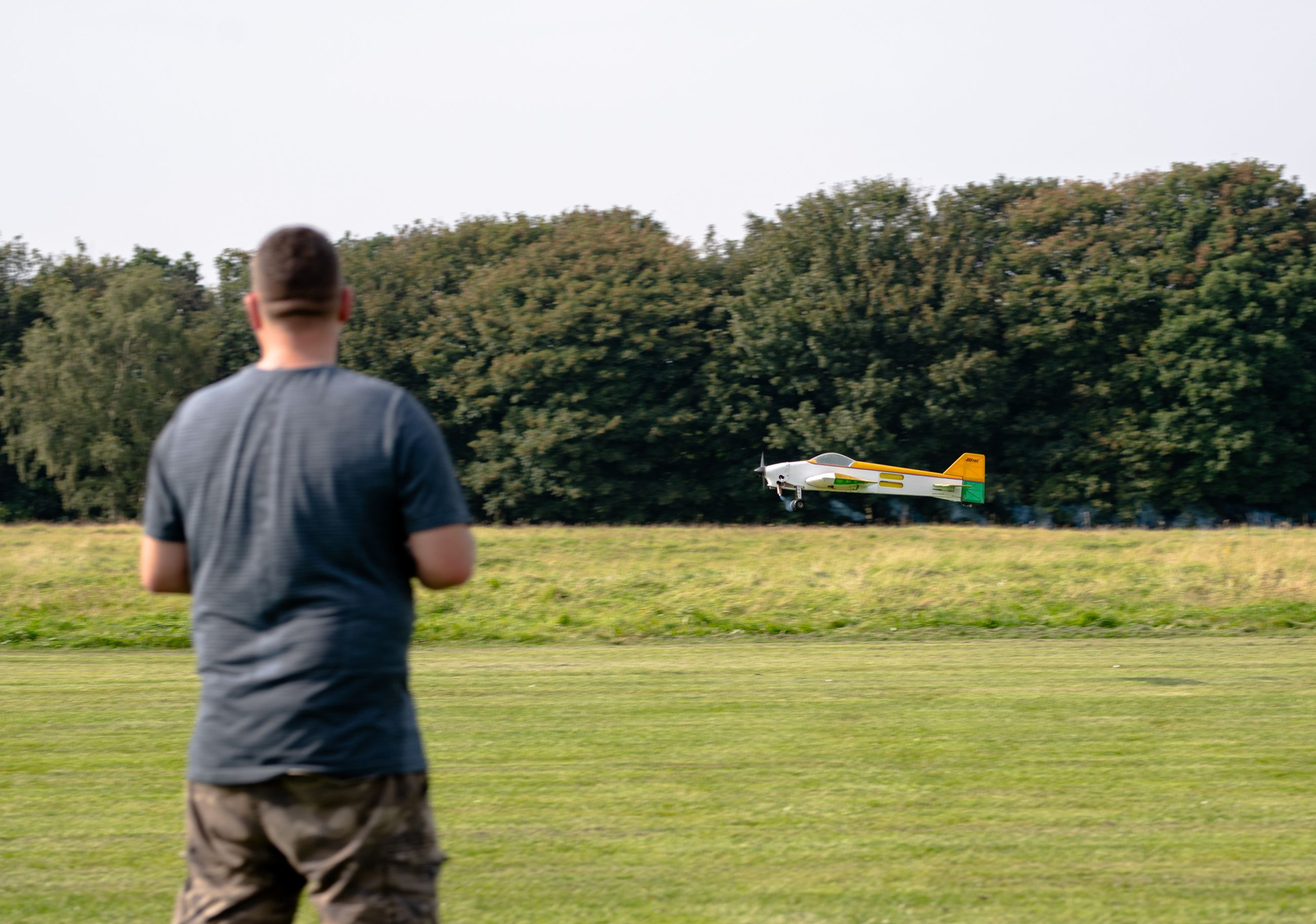 RC pilot wating his plane fly Infront 