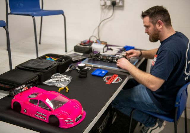 Pink RC car being worked on
