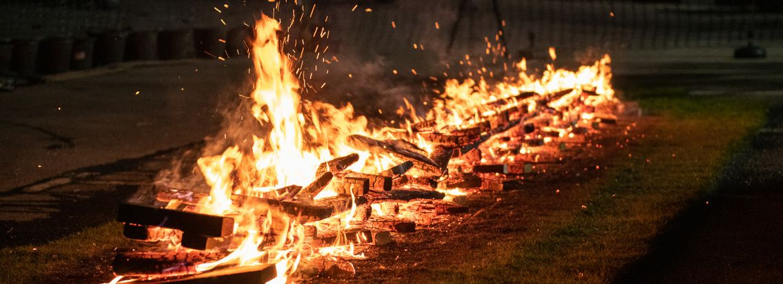 Burning coals in a line ready to be walked on 