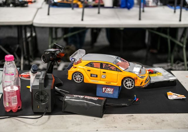 Orange and grey RC car on the table