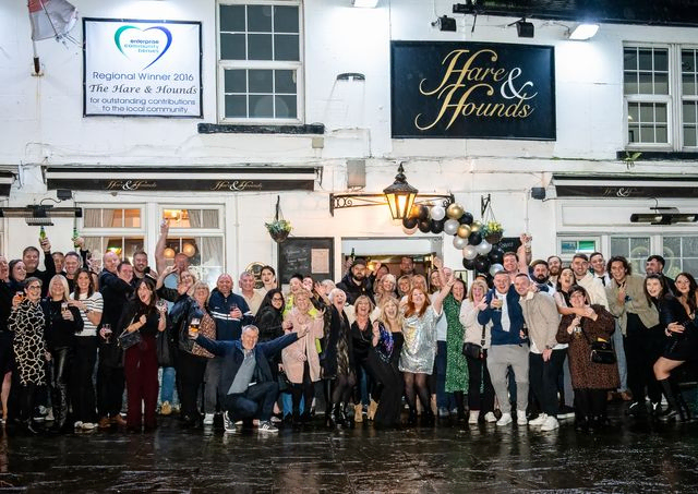 Large group image of everyone outside a pub