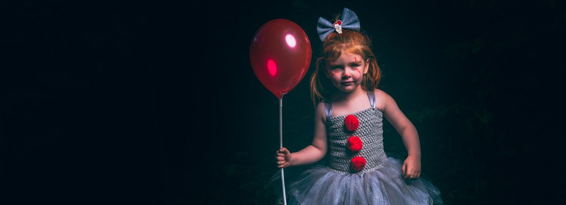 Little girl dressed as IT the clown 