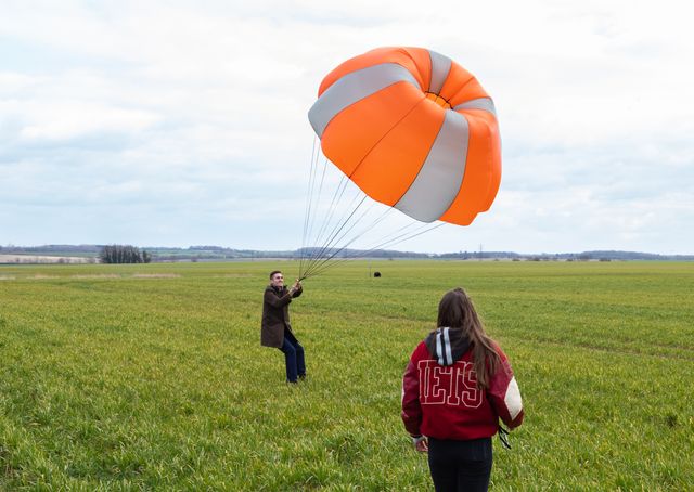 two students testing a parachute 