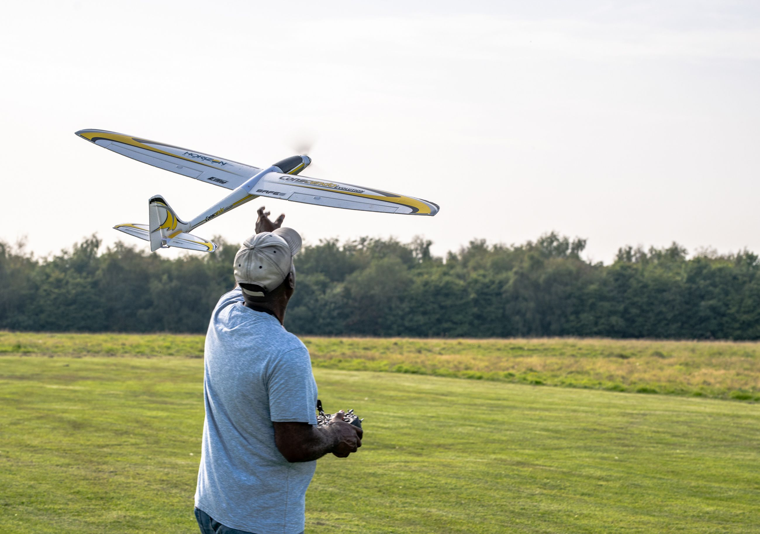 Man throwing his RC glider