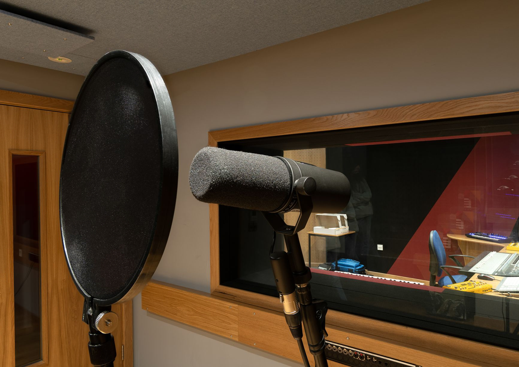 Microphone looking through recording room