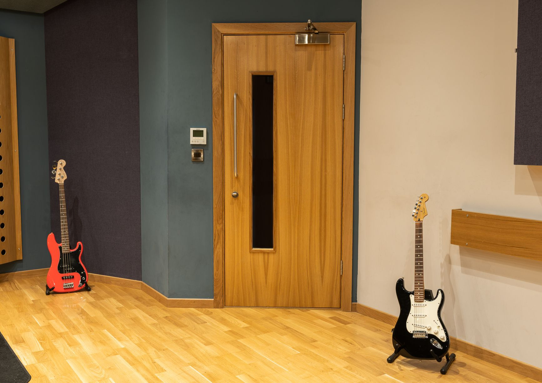 two guitars and a door